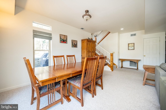 3084 Lake Shore Dr, Oakland, MD 21550 - dining area with stairway, light carpet, visible vents, and baseboards
