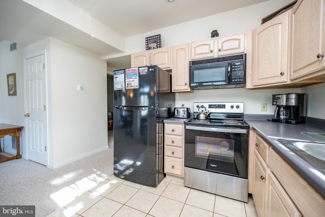 3084 Lake Shore Dr, Oakland, MD 21550 - kitchen with light brown cabinets, black appliances, dark countertops, and visible vents