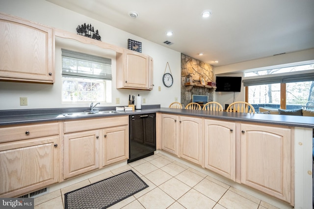 3084 Lake Shore Dr, Oakland, MD 21550 - kitchen with light brown cabinetry, a sink, dark countertops, visible vents, and black dishwasher