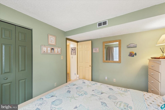 bedroom featuring a textured ceiling