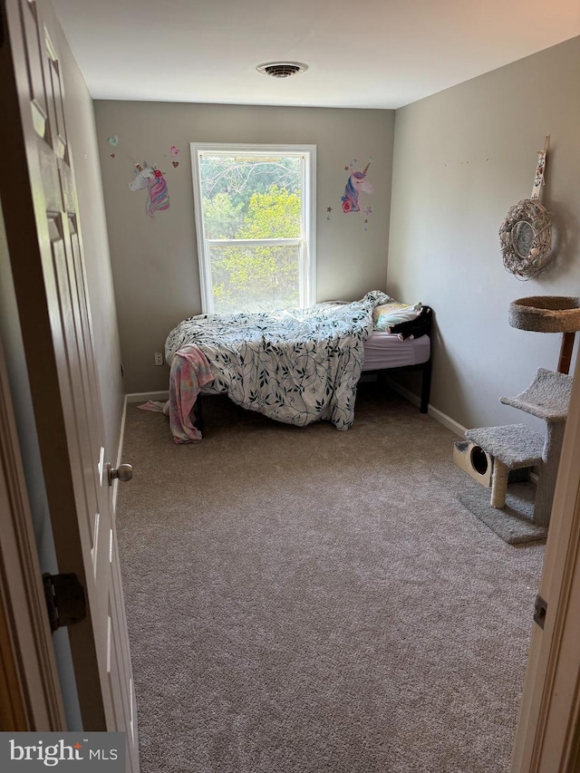 bedroom with carpet flooring and baseboards