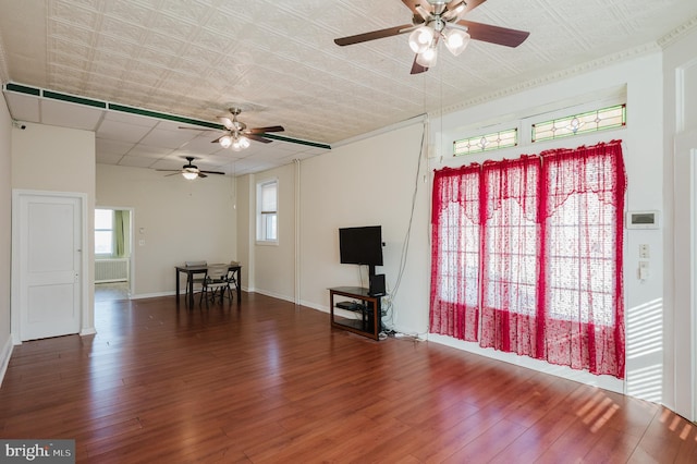 unfurnished living room with dark hardwood / wood-style flooring