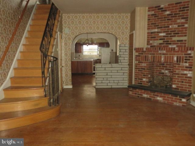 unfurnished living room with hardwood / wood-style floors