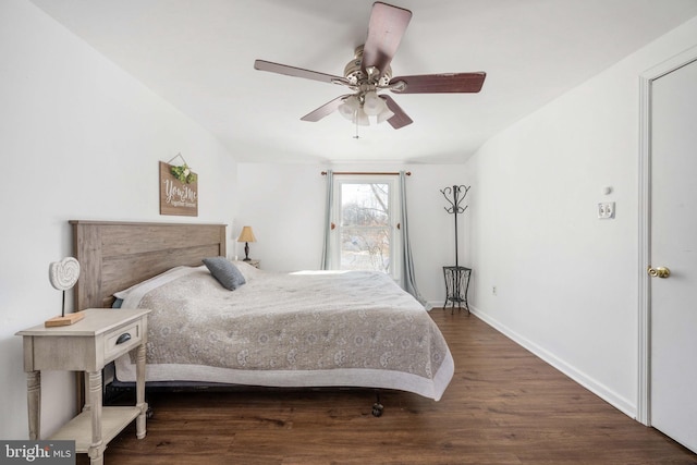 bedroom featuring ceiling fan, baseboards, and wood finished floors