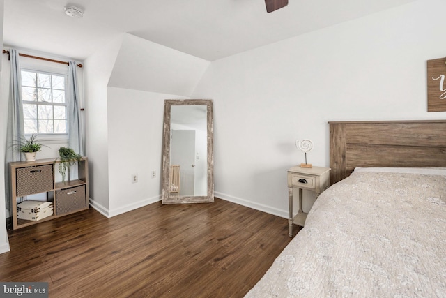 bedroom with ceiling fan, baseboards, lofted ceiling, and wood finished floors