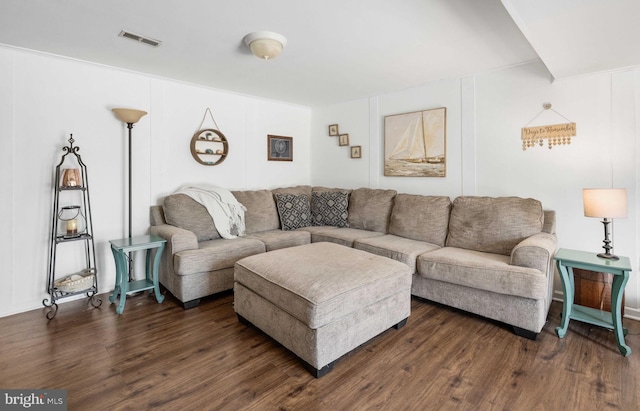 living area with visible vents and dark wood finished floors