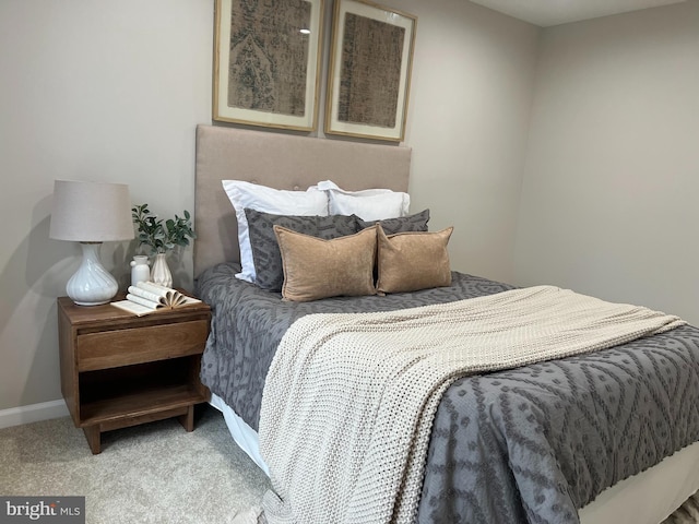 bedroom with carpet and baseboards