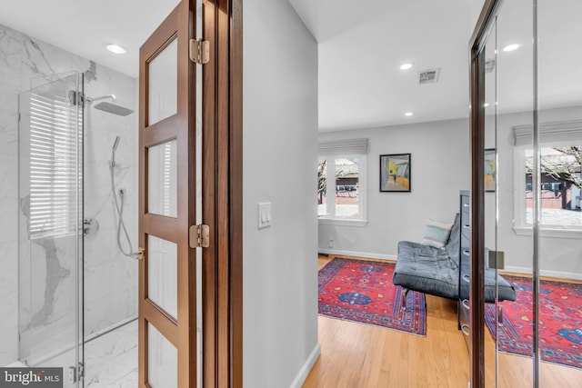 hallway featuring light hardwood / wood-style floors