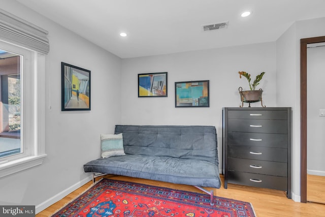 living area with light hardwood / wood-style floors