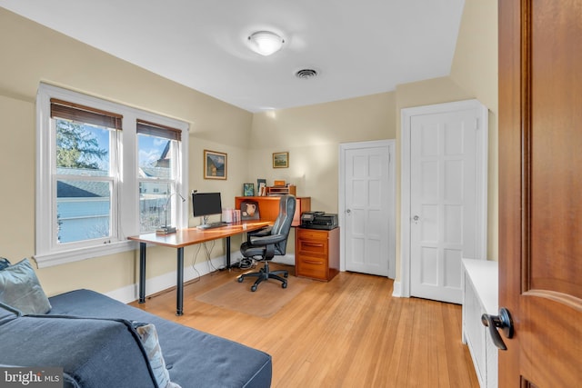 office space with light hardwood / wood-style floors