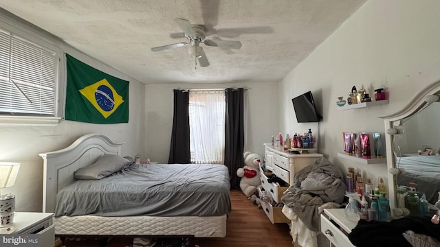 bedroom featuring dark wood-type flooring and ceiling fan