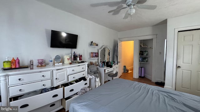 bedroom featuring light hardwood / wood-style flooring and ceiling fan