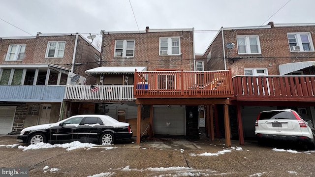 rear view of house featuring a deck