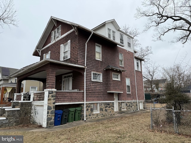 view of home's exterior featuring fence