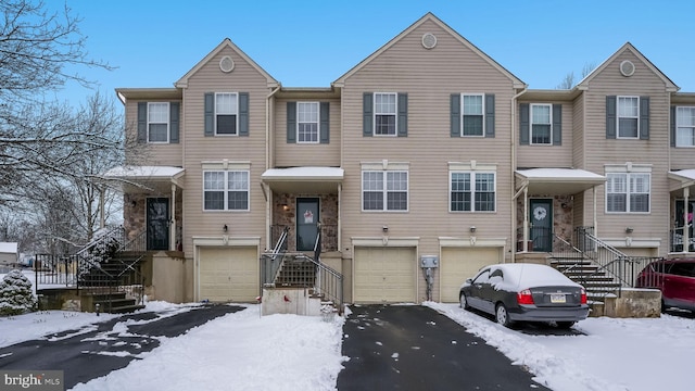 multi unit property featuring a garage