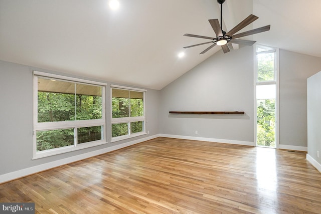 unfurnished living room with ceiling fan, lofted ceiling, and light hardwood / wood-style floors