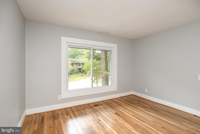 spare room with light wood-type flooring