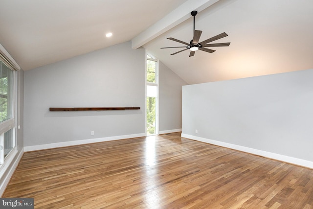 unfurnished living room featuring ceiling fan, beam ceiling, high vaulted ceiling, and light wood-type flooring