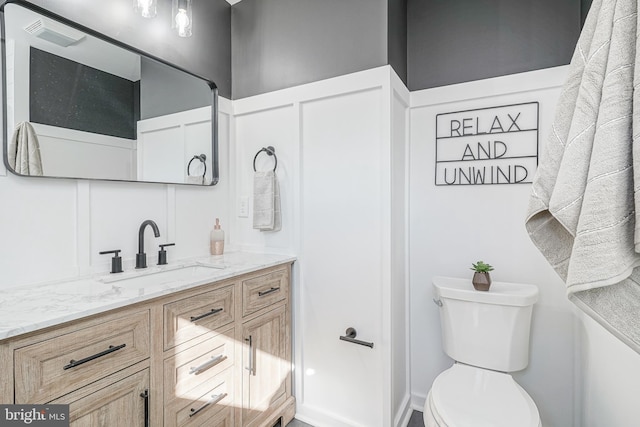 bathroom with vanity and toilet