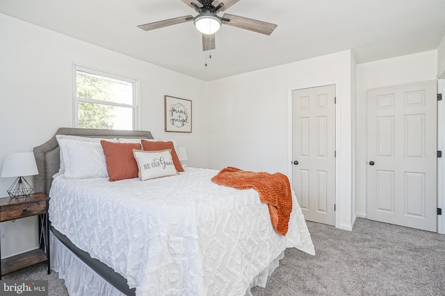 bedroom with ceiling fan and carpet flooring