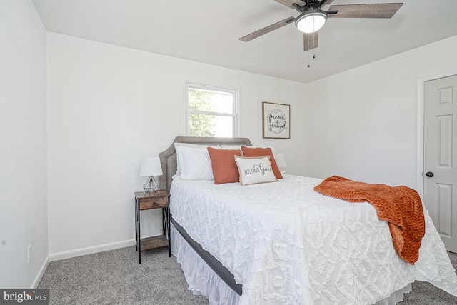 bedroom featuring light colored carpet and ceiling fan