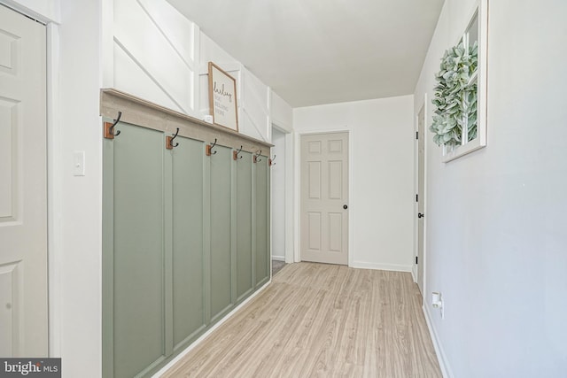 mudroom with light hardwood / wood-style flooring