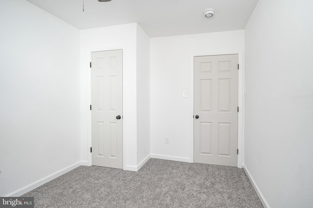 unfurnished bedroom with carpet flooring