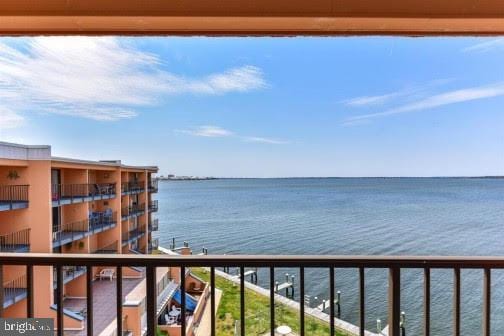 balcony featuring a water view