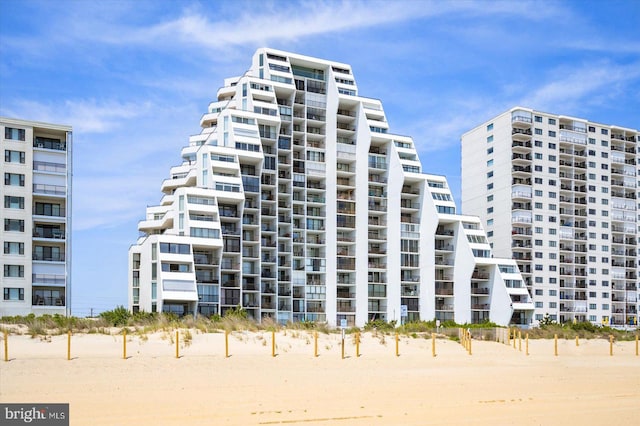 view of building exterior with a view of the beach