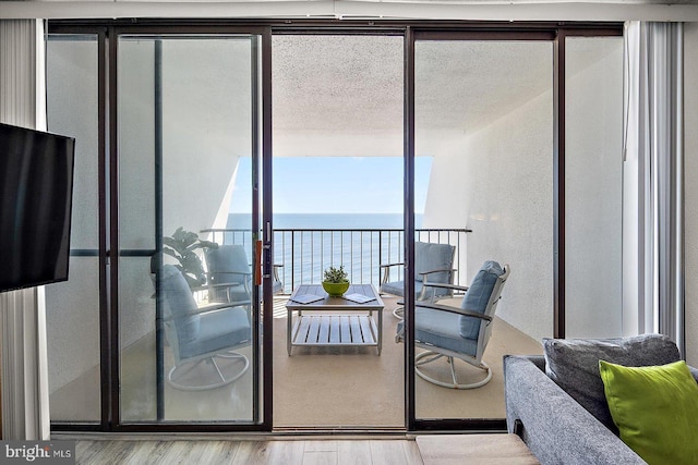 balcony featuring a water view