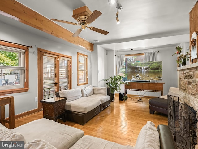 3137 18th St NE, Washington, DC 20018 - living area featuring hardwood / wood-style flooring, a ceiling fan, and baseboards