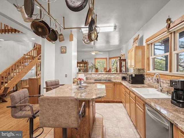 3137 18th St NE, Washington, DC 20018 - kitchen with a wealth of natural light, appliances with stainless steel finishes, a sink, and a kitchen island