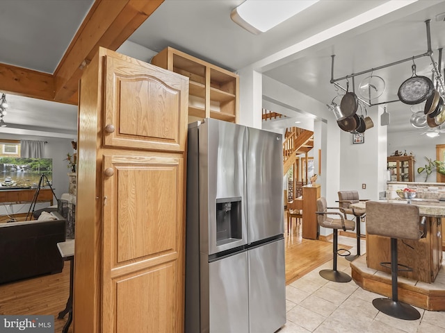 3137 18th St NE, Washington, DC 20018 - kitchen featuring stainless steel refrigerator with ice dispenser and light tile patterned floors