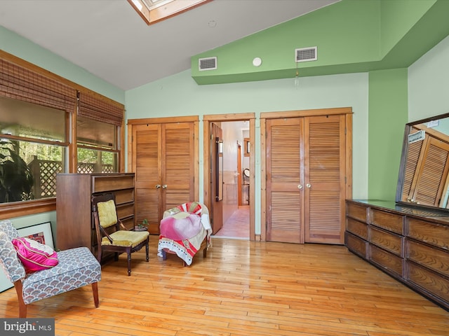 3137 18th St NE, Washington, DC 20018 - sitting room featuring visible vents, hardwood / wood-style floors, high vaulted ceiling, and a skylight