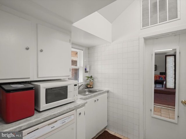 3137 18th St NE, Washington, DC 20018 - kitchen with white appliances, tile walls, a sink, white cabinetry, and visible vents