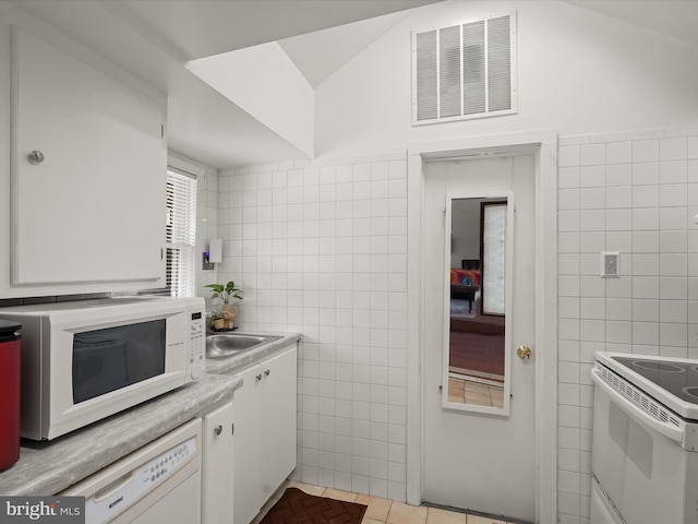 3137 18th St NE, Washington, DC 20018 - kitchen featuring tile walls, white appliances, visible vents, white cabinetry, and light countertops