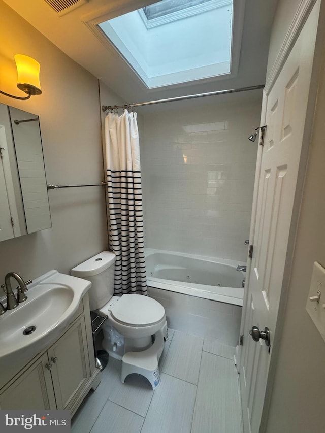 full bathroom with toilet, a skylight, visible vents, vanity, and shower / bath combo