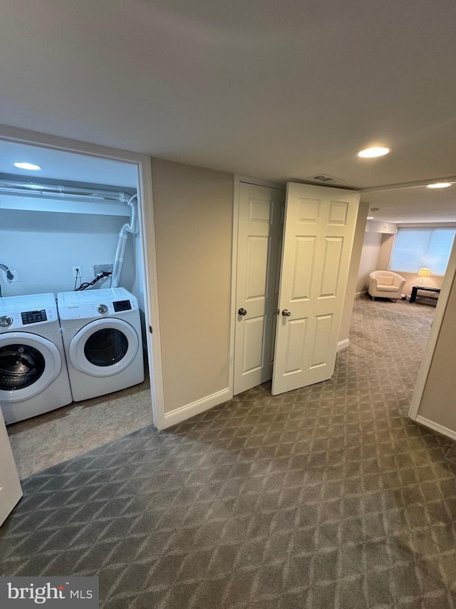 clothes washing area featuring recessed lighting, dark carpet, washing machine and dryer, and baseboards