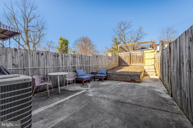 view of patio featuring a fenced backyard and central air condition unit