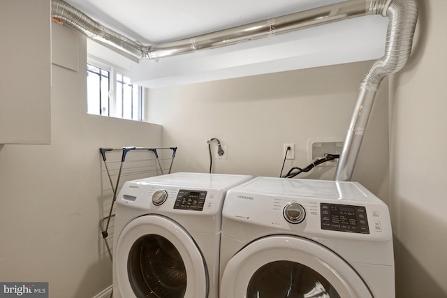 washroom featuring independent washer and dryer