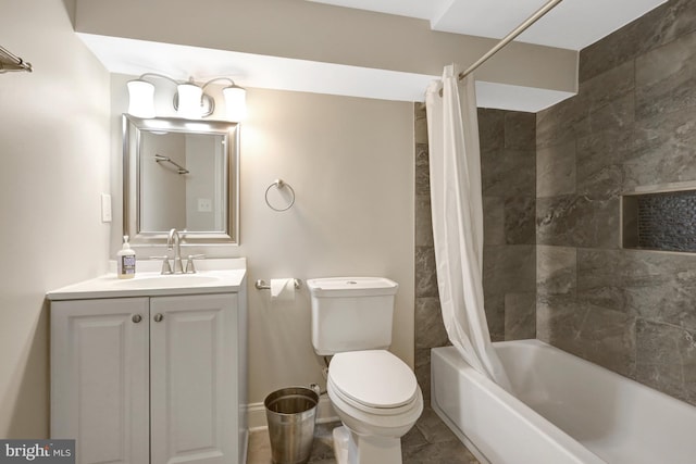 full bathroom featuring shower / bath combo with shower curtain, vanity, and toilet