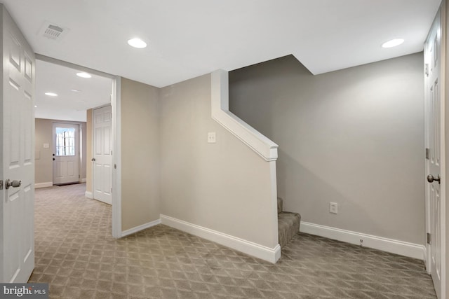 interior space featuring light carpet, stairway, recessed lighting, and baseboards