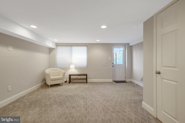 unfurnished room with recessed lighting, light colored carpet, and baseboards