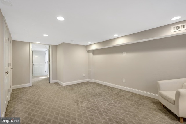 finished basement with carpet, visible vents, baseboards, and recessed lighting