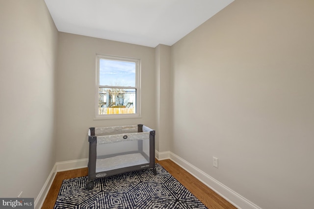 interior space featuring wood finished floors and baseboards