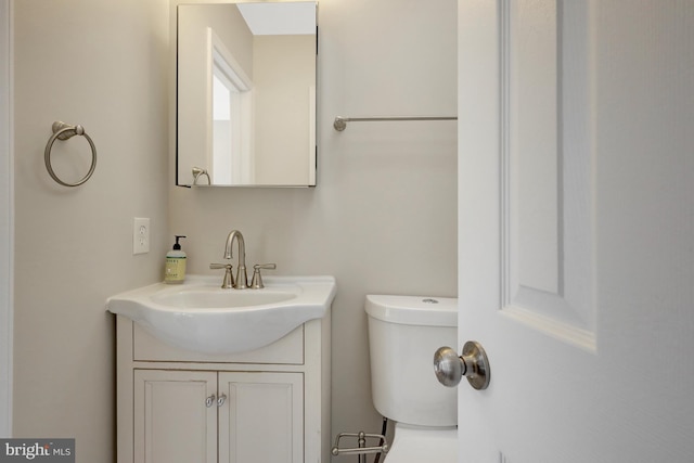 half bath with toilet and vanity