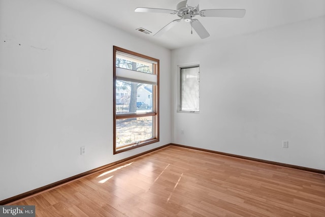 spare room with ceiling fan and light hardwood / wood-style flooring