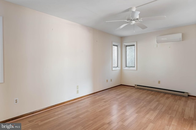 spare room with a baseboard heating unit, light hardwood / wood-style flooring, a wall mounted AC, and ceiling fan