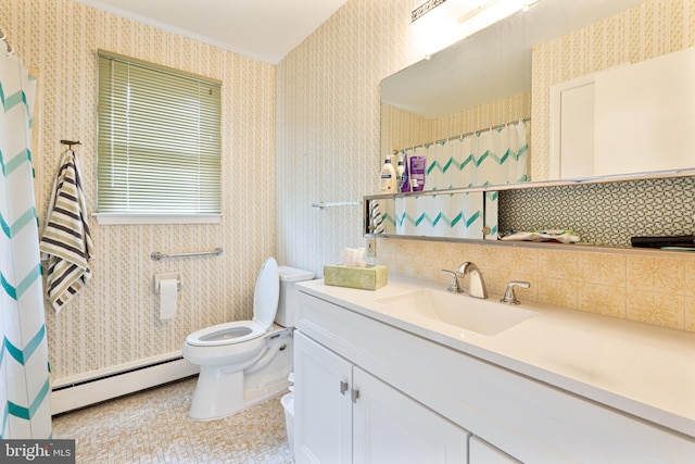 bathroom featuring vanity, a baseboard heating unit, and toilet