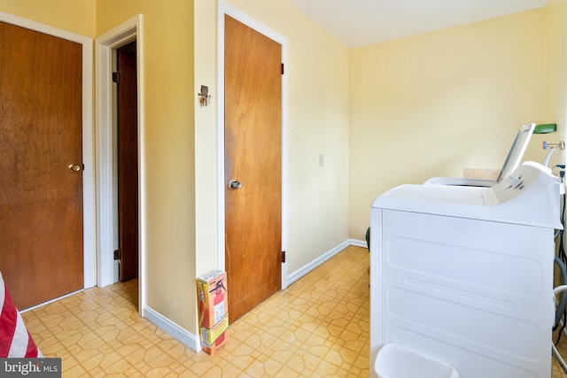 laundry room with washing machine and dryer